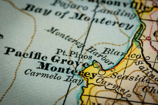 Selective focus close up of original vintage map of the Monterey region of Southern California. Old style cartography and drawing of the terrain relief. Map is from 