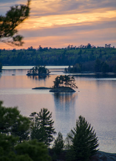 Vibrant sunset overlooking a lake with islands