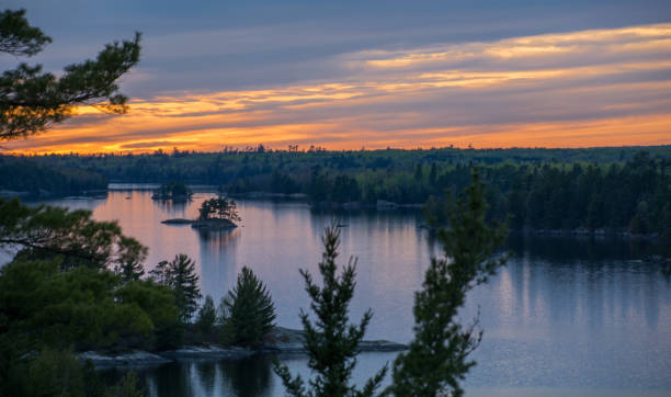 istock Vibrant sunset overlooking a lake with islands 1223088092