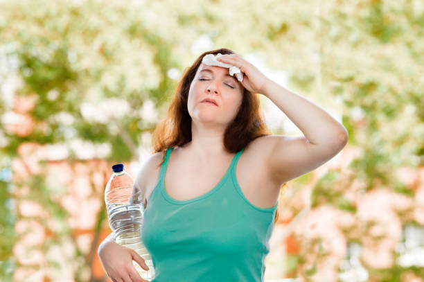 istock woman sweating suffering a heat strok 1223088961