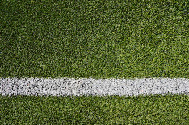 Artificial soccer grass field Artificial soccer grass field detail with white goal line. sports chalk stock pictures, royalty-free photos & images