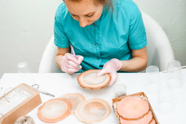 istock Creativity and craft. A young girl creates coasters from resin. Gift wrapping. Decorative packaging. Idea for business. Remote work, work at home. Art coasters. 1223089212