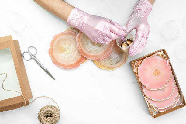 istock Creativity and craft. A young girl creates coasters from resin. Gift wrapping. Decorative packaging. Idea for business. Remote work, work at home. Art coasters. 1223089226