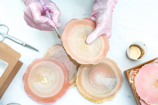istock Creativity and craft. A young girl creates coasters from resin. Gift wrapping. Decorative packaging. Idea for business. Remote work, work at home. Art coasters. 1223089229