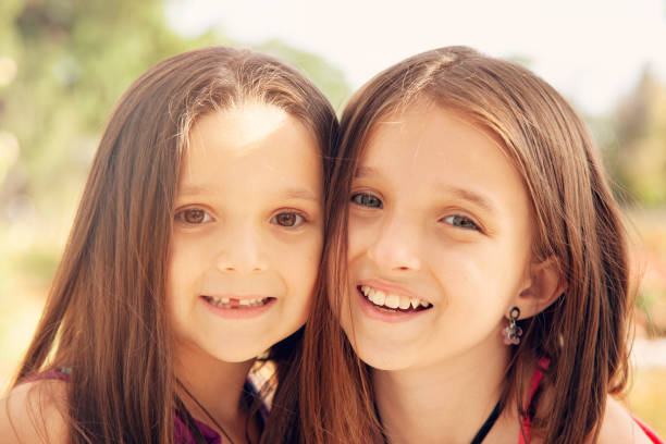 istock Happy sisters portrait outdoors 1223092426