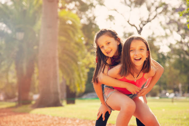 istock Happy sisters portrait outdoors 1223092569