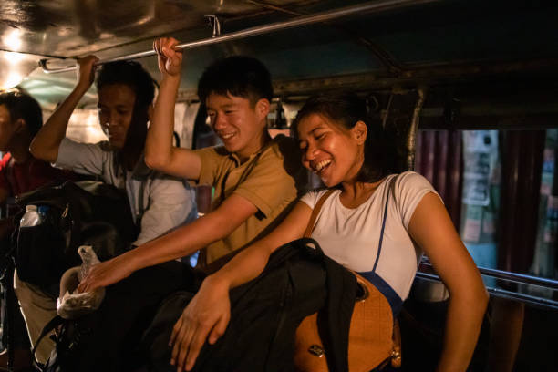 istock Young Asian friends talking in jeepney 1223093526