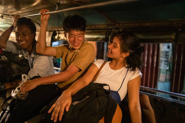 istock Young Asian friends talking in jeepney 1223093616