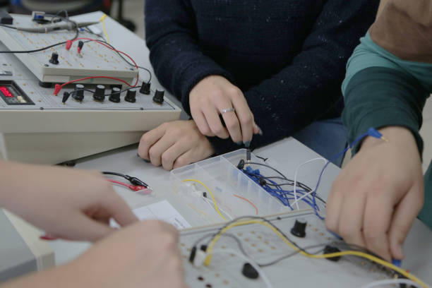 istock Group of young students in technical vocational training with teacher, the lesson in technical college. 1223093620
