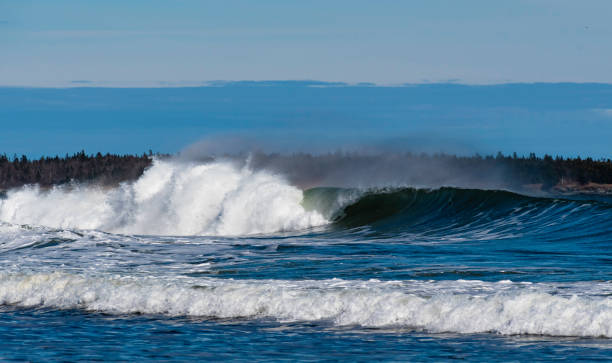 istock Waves carshing onto rocky shore 1223093715