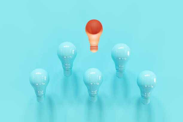 istock Outstanding Orange Light bulb slump leader with blue light bulbs on blue background. 3D Render. Minimal Creative idea. 1223101893