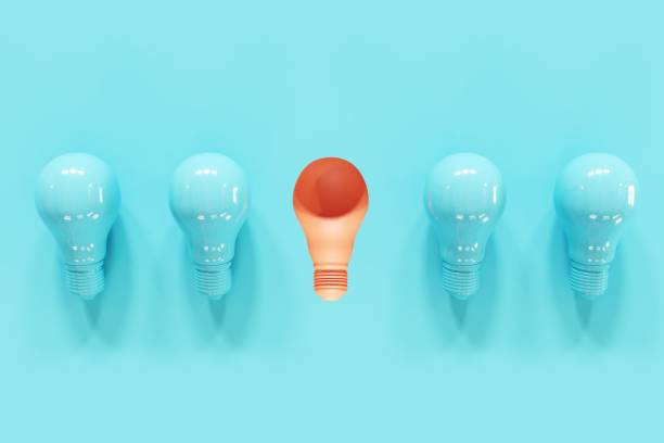 istock Orange Light bulb slump with blue light bulbs on blue background. 3D Render. Minimal Creative idea. 1223101896