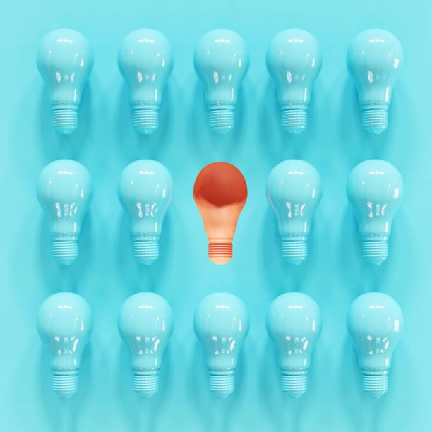 istock Outstanding Orange Light bulb slump Among blue light bulbs on blue background. 3D Render. Minimal Creative idea. 1223101913