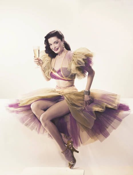 young woman in ruffled dress holding beer glass, portrait - 1952 stok fotoğraflar ve resimler