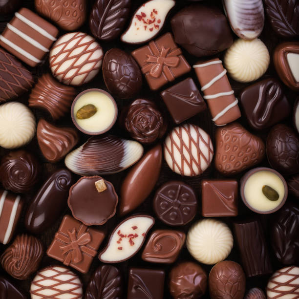 istock assorted sweet food, chocolate truffle and candy background 1223104225