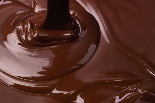istock hot melted chocolate background, splash of liquid cocoa 1223104290