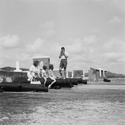 Accra, Ghana - June 1958: Black and white photo of African women carrying pots on their heads in Accra, Ghana taken in 1958