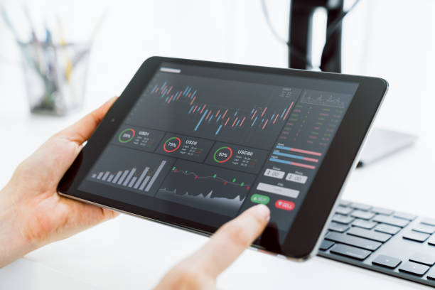 istock Stock exchange market concept, Hand trader touch on digital tablet with graphs analysis candle line on the table in house, diagrams on screen. 1223105342