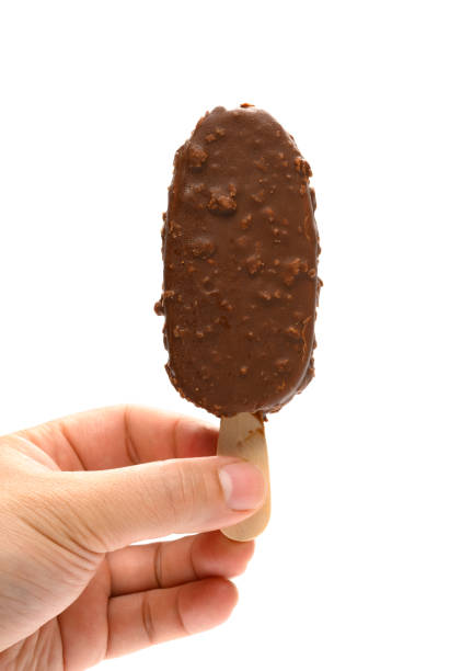 istock hand holding a fresh chocolate and coffee flavor popsicle on white background 1223110388