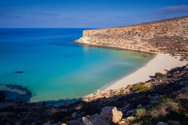 View of the most famous sea place of Lampedusa, It is named Spiaggia dei conigli, in English language Rabbits Beach or Conigli island View of the most famous sea place of Lampedusa, It is named Spiaggia dei conigli, in English language Rabbits Beach or Conigli island, Sicily 3610 stock pictures, royalty-free photos & images