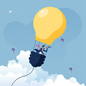 istock Businessman searching for opportunities in hot air balloon light bulb-Business concept vector 1223113343