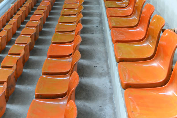 istock lines of orange stadium seats 1223113916