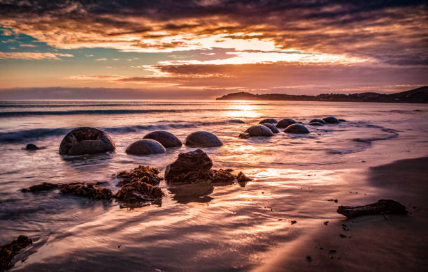 istock Moeraki Boulders in a Golden Sunrise 1223114089