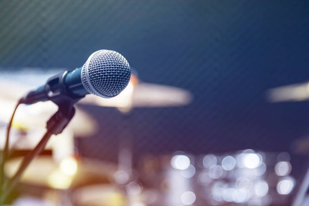 istock Professional condenser studio microphone, Musical Concept. recording, selective focus  microphone in radio studio, selective focus microphone and blur musical equipment guitar ,bass, drum piano background. 1223114270