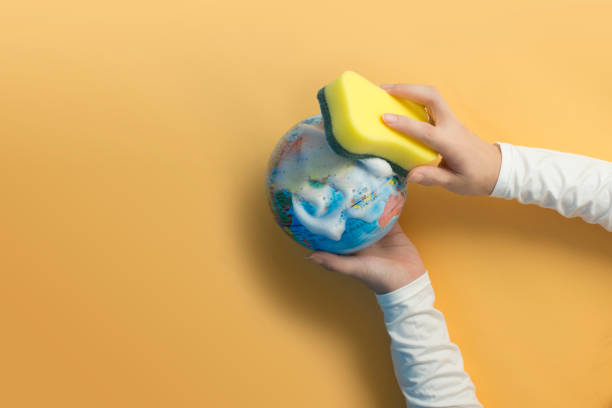 istock Women hands holding earth and cleaning it 1223114316