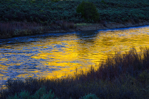 Canyon River Reflections - Warm sunset light reflecting off cliffs above.