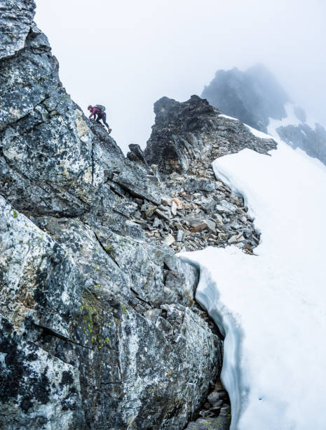 istock Rock climbing on a mountain ridge 1223119952