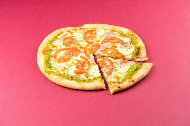 istock pizza close-up, isolated, against a colored background. whole pizza 1223120134