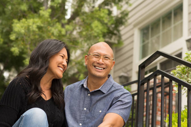 istock Happy Asian couple smiling and hugging outside. 1223120179