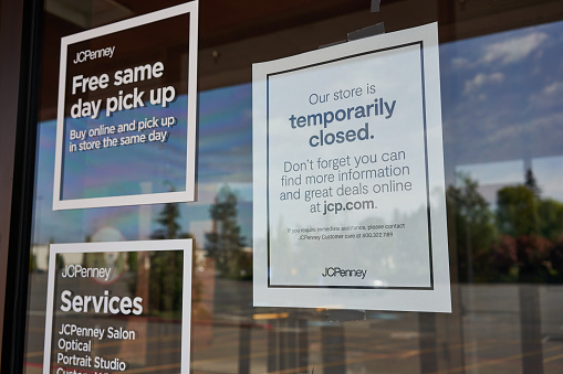 Tigard, OR, USA - May 5, 2020: A temporary closure notice is seen at the entrance to a closed JCPenney store in Tigard, a suburb in the Portland metro area in Oregon.