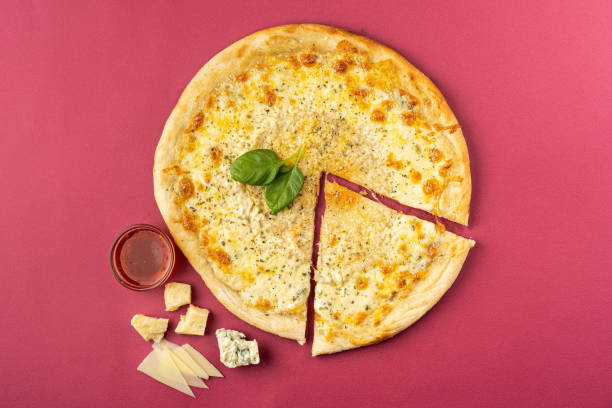 istock pizza close-up, isolated, against a colored background. whole pizza 1223124366