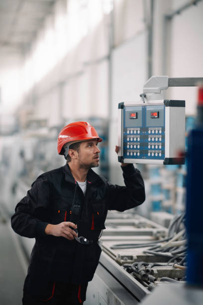 istock Young handsome man working in factory 1223124630