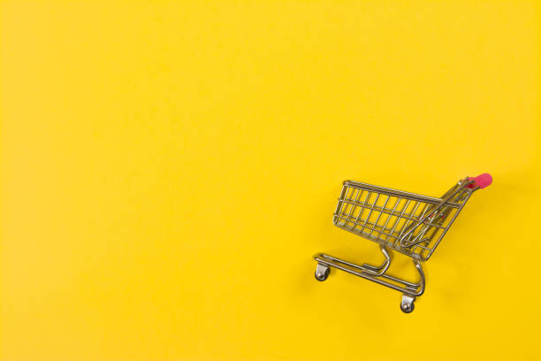 istock Fast shopping cart on yellow background with copy space for text 1223126615