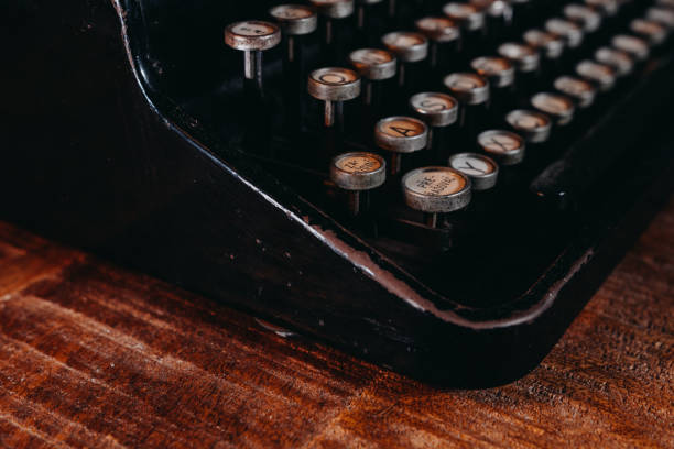 istock Typewriter vintage retro styled on the wood table 1223127589