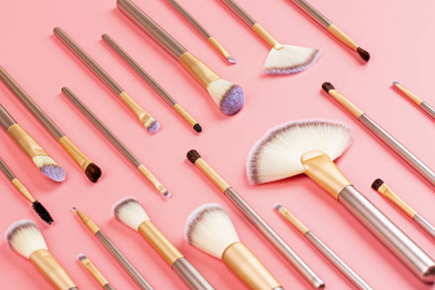 istock Cosmetic Makeup brushes on pink background. Flat lay, top view, copy space 1223128151