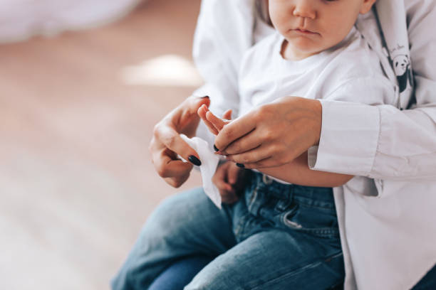 istock mom and baby rub their hands 1223128858
