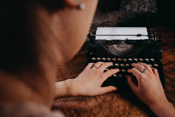 istock Typewriter vintage retro styled on the wood table 1223128894