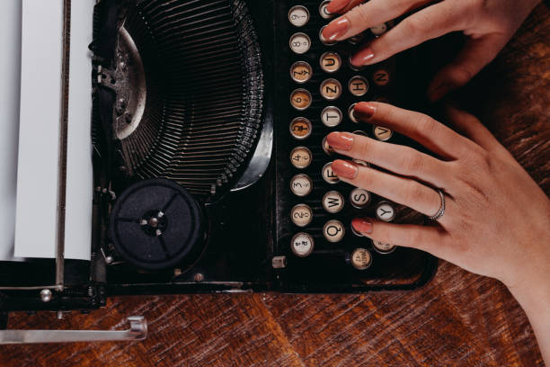 istock Typewriter vintage retro styled on the wood table 1223129205