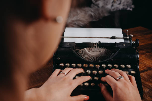 istock Typewriter vintage retro styled on the wood table 1223129387