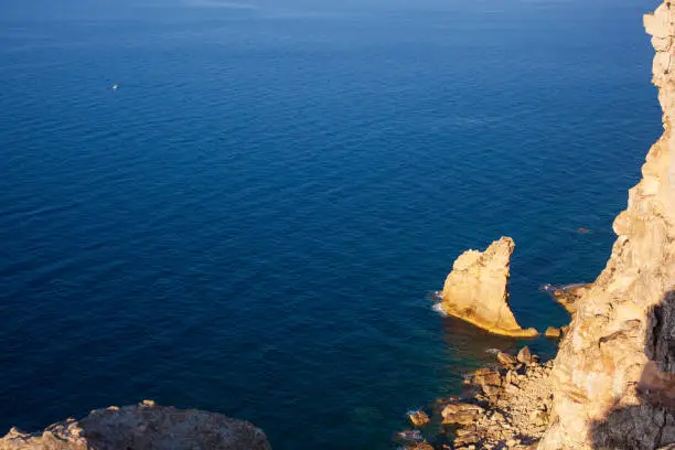 View of the famous cliff called La vela in Lampedusa, Sicily