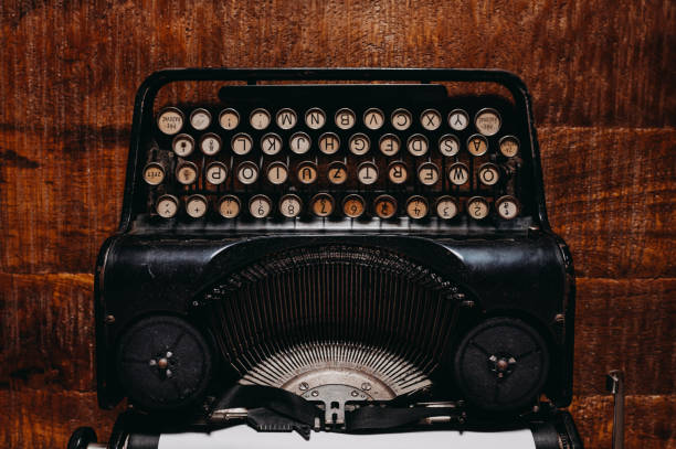 istock Typewriter vintage retro styled on the wood table 1223130337