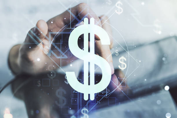 Creative concept of USD symbols illustration and finger clicks on a digital tablet on background. Trading and currency concept. Multiexposure stock photo