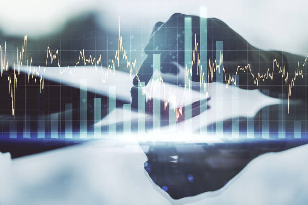 istock Multi exposure of abstract financial graph and hand working with a digital tablet on background, financial and trading concept 1223132046