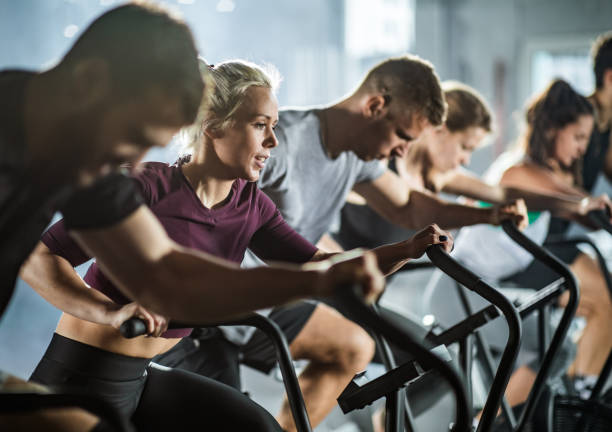 istock gym training on stationary bikes! 1223133059