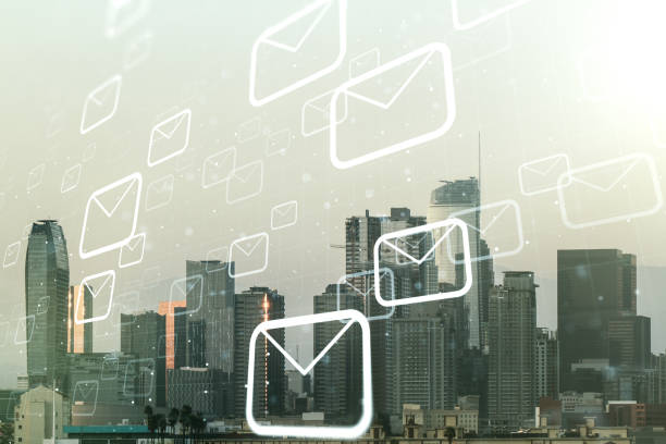 istock Abstract virtual postal envelopes sketch on Los Angeles office buildings background, e-mail and marketing concept. Double exposure 1223133897