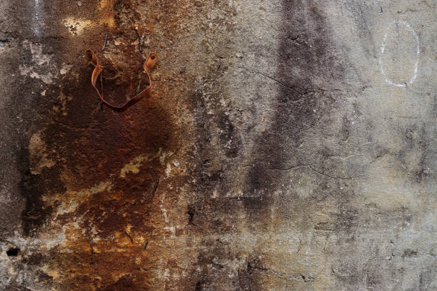 istock Rust on a rock wall from an old metal hook 1223134040